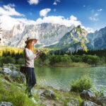 Young woman making sketches on the nature